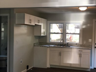 Kitchen featuring dark hardwood / wood-style floor