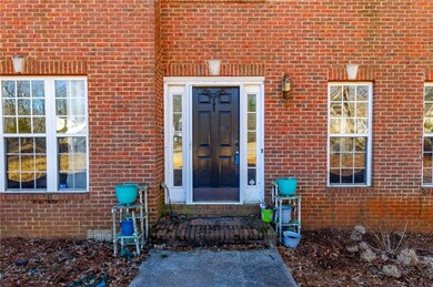 Doorway to property with brick siding
