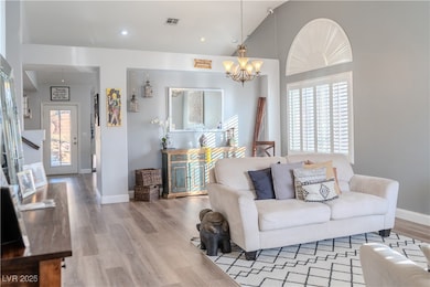 Living area featuring wood finished floors, a chan
