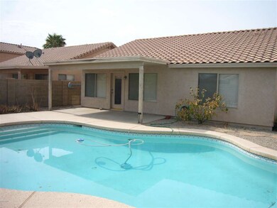 back of house with covered patio