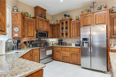Kitchen has granite counter tops and stainless steel appliances.