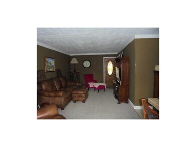 Living Room. Please wear shoe coverings provided o