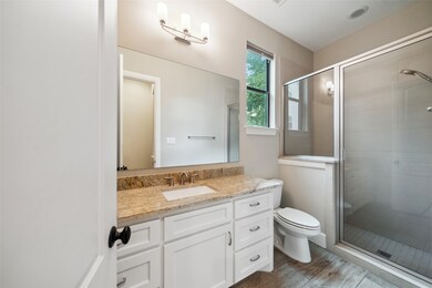 Modern bathroom with a spacious glass-enclosed sho