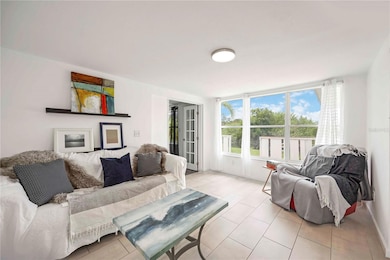 Living Room with adjacent third bedroom.