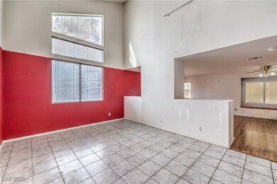 Tiled empty room featuring a wealth of natural lig