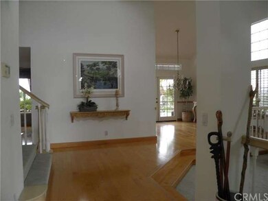 Grand vaulted ceiling entry with gorgeous hardwood
