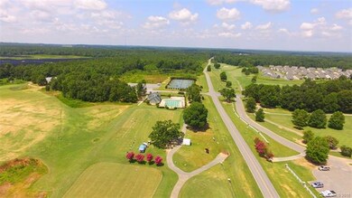 Aerial view of the driving range, pools and tennis
