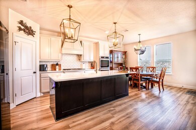 Kitchen with light wood finished floors, an inviti