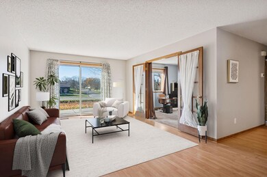 A virtually staged living room and 2nd BR / office area.