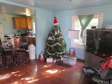 Living Room opens to Dining Area and Kitchen