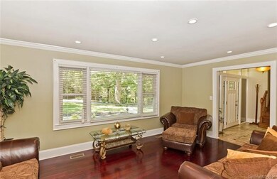 Front living area with cherry floors