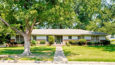 Single story home featuring a front yard