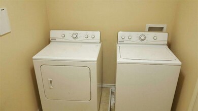 Laundry room featuring washer and clothes dryer