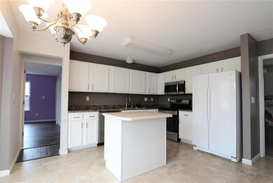 Kitchen, master suite addition to the left, laundr