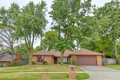 Ranch-style house featuring brick siding, a shingled roof, concrete driveway, and an attached garage