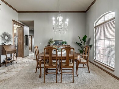 Dining room featuring a chandelier, a healthy amou