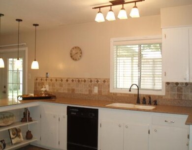 Kitchen. DISHWASHER, GRANITE, PENDANT LIGHTING