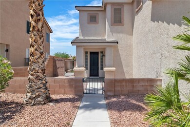 Property entrance featuring a gate and stucco sidi