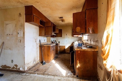 Kitchen with brown cabinetry