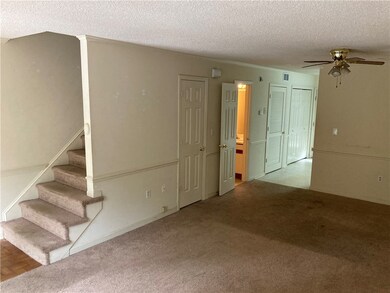 Living Room leading to the kitchen.  The open door