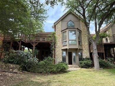 Rear view of property featuring a yard and a deck