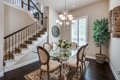 Elegant dining room featuring decorative chandelie