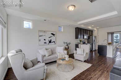 Main level living room flows right into the kitche