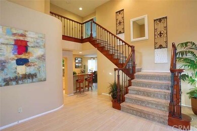 Entry showing custom stair railing, two story entr