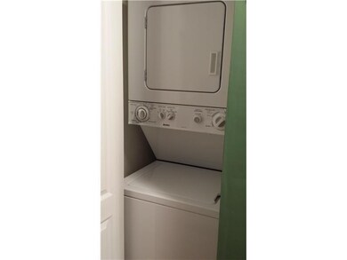 Other. Stackable washer and dryer in kitchen close