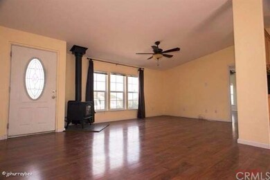 Entry to home and living room with wood burning wo
