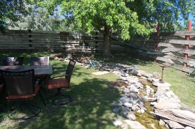 PARK LIKE YARD W/STREAM & FIRE PIT