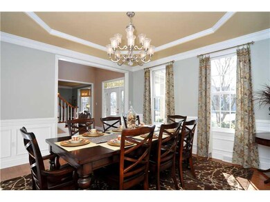 Dining Room. Raised trey ceiling, wainscoting with