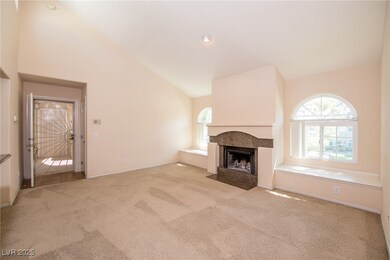 Unfurnished living room with a fireplace with flus