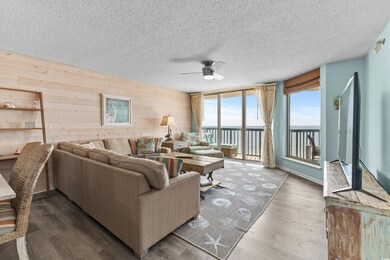 Living room with a textured ceiling, ceiling fan, 