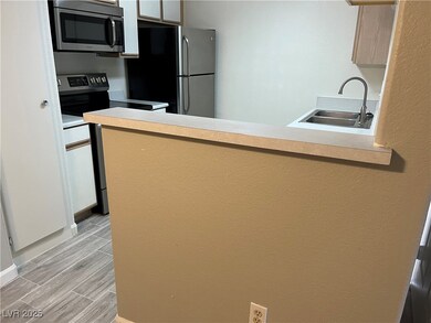 Kitchen with appliances with stainless steel finis