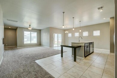 Kitchen featuring light tile floors, sink, ceiling