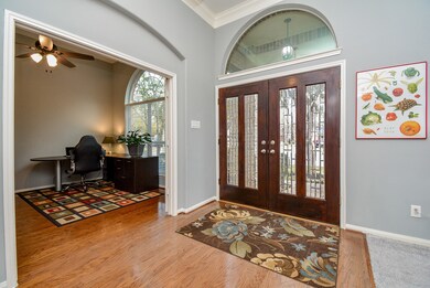 Welcome all! Huge, floor-to-ceiling window treatment is seen here, left, in what can become a home office, or anything you wish! Super- wide open doorways; high ceilings and arched wall details are luxurious!