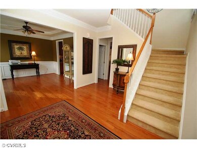 Foyer - Spacious foyer with hardwood floors, crown