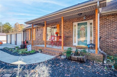 Front of Home with Coverd Front Porch - new custom built shutters and columns 
