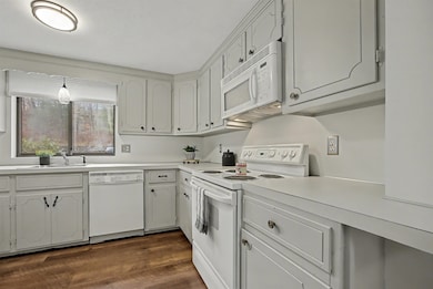 freshly painted cabinets, new laminate flooring, fresh paint walls/ceiling