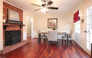 Lovely dining space with fireplace.