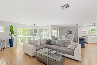 Living room with light wood-type flooring, ceiling