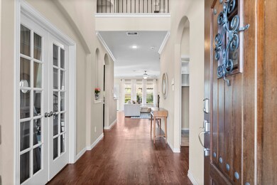 Bright and inviting entryway featuring hardwood fl