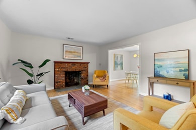 Beautiful living room with hardwood floors and a wood burning fireplace
