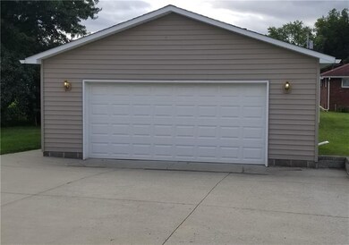 Double car garage with cement driveway