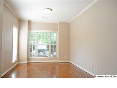 Hardwood floors and crown molding in the living ar
