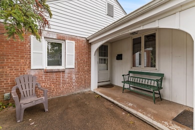 Charming breezeway connects house to garage