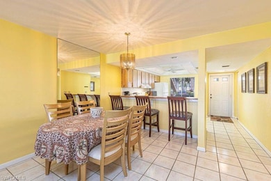 Dining space featuring a notable chandelier and li