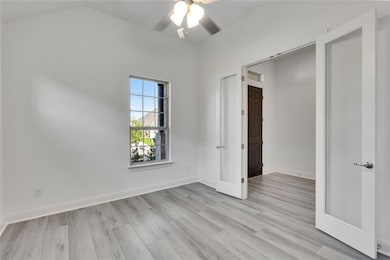 Spare room with ceiling fan, light wood-type floo