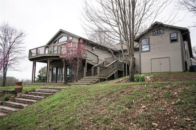 The back of the home is just as lovely....so many decks & patio's to enjoy!
